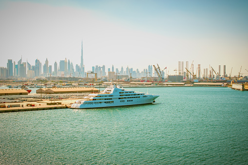 Cruise ship or yacht in port of Dubai, United Arab Emirates, Middle East.