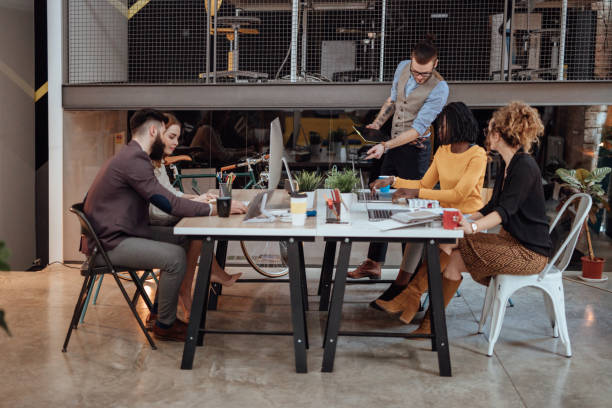 istock Busy coworkers working in modern office 920612354