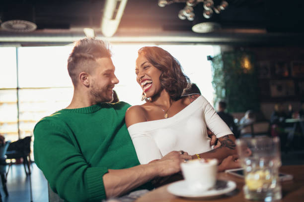 istock Mixed race couple having coffee together in cafe 920616860
