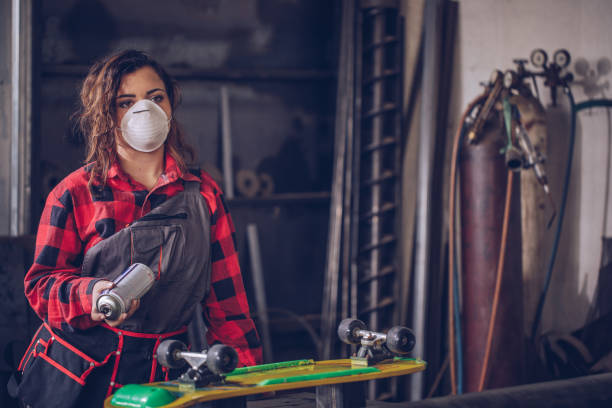 istock Woman repairing skateboard 920619752