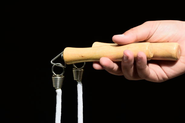istock A hand holds a jump rope against a black background 920628950