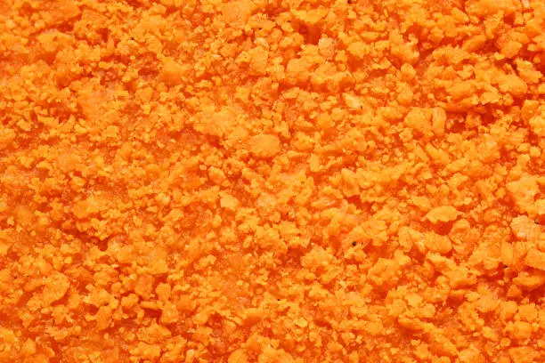 Texture of orange crispy chicken nugget. Macro shot