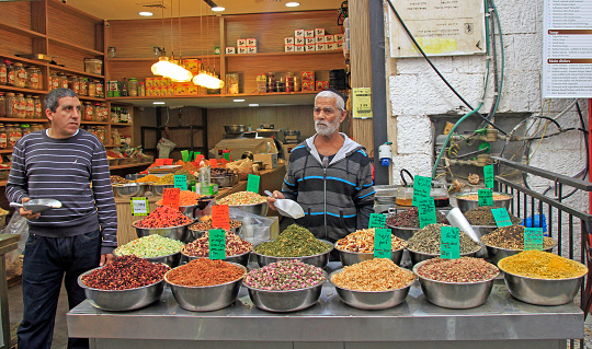 Jerusalem, Israel - December 1, 2017: man is selling tea at Machane Yehuda Market in Jerusalem, Israel