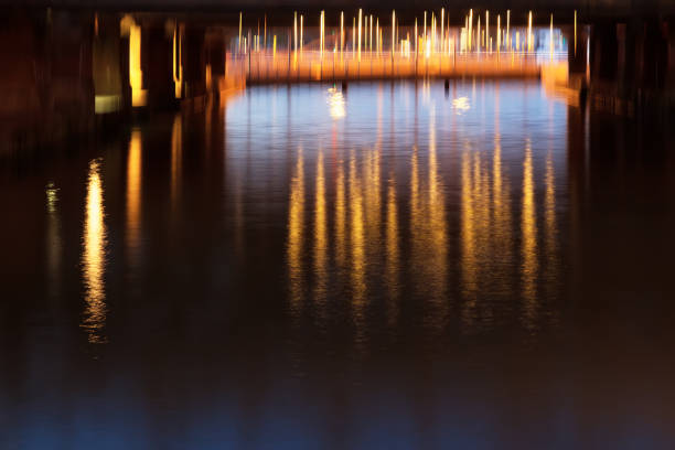 istock Abstract background, city lights reflecting in the water 920638084