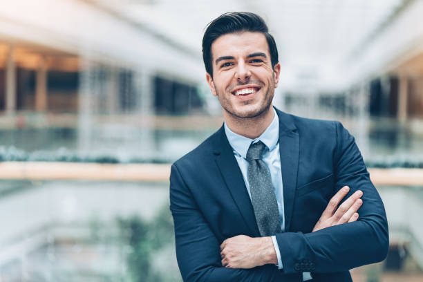 istock Smiling businessman inside modern office building 920638170