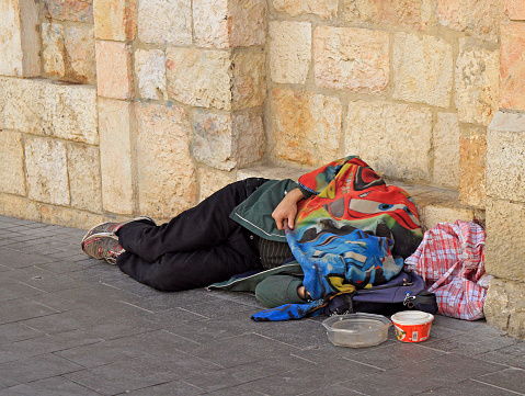 Jerusalem, Israel - December 1, 2017: homeless is sleeping outdoor in Jerusalem Israel