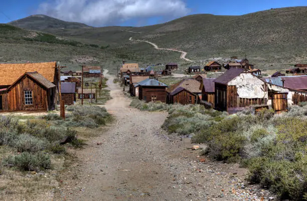 A dirt road running through the abandoned ghost town Bodie in Central California.