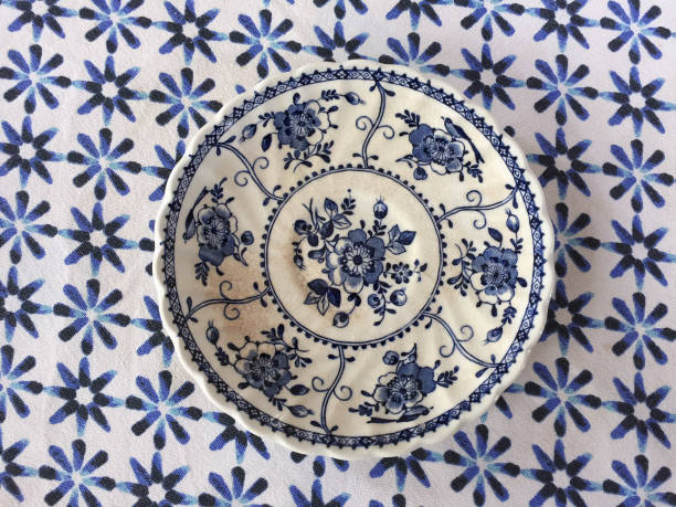 istock vintage white and blue plate on tablecloth background 920662934