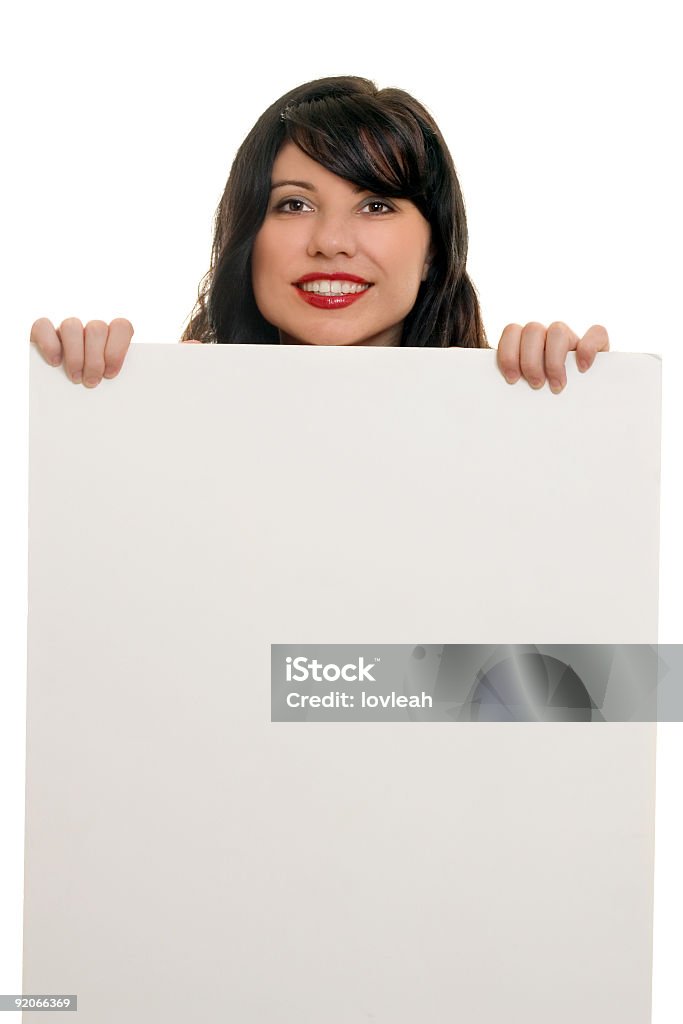 Donna sorridente con un segno per la pubblicità - Foto stock royalty-free di Adulto