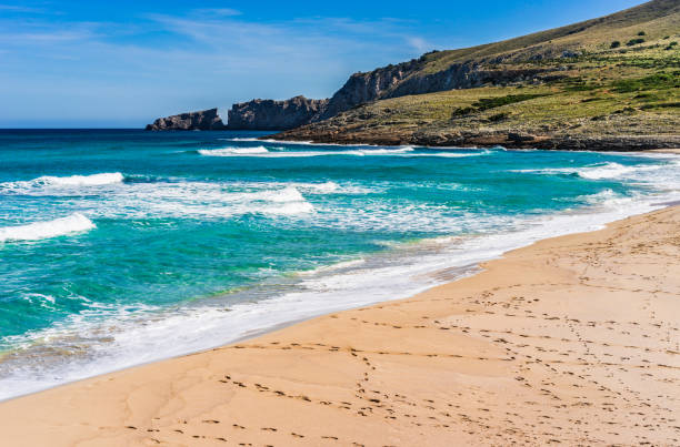 istock Footsteps on sandy beach, beautiful seaside on Majorca island, Spain 920679078