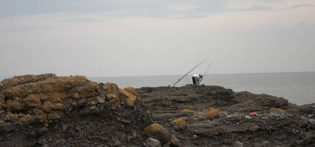 istock Southerndown Men fishing 92068329
