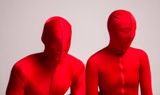 istock People in red suits on a white background 920695574