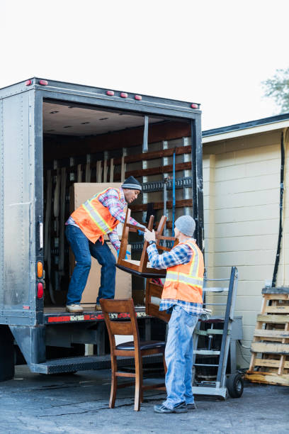 istock Two workers with a truck, moving furniture 920699030