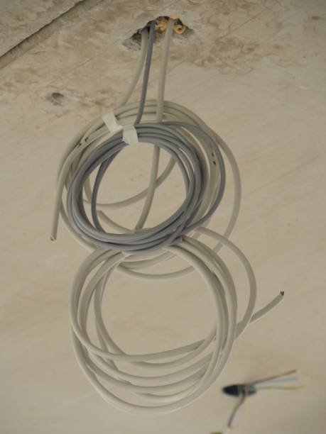 istock Two rolled wires sticking out of ceiling 920706438