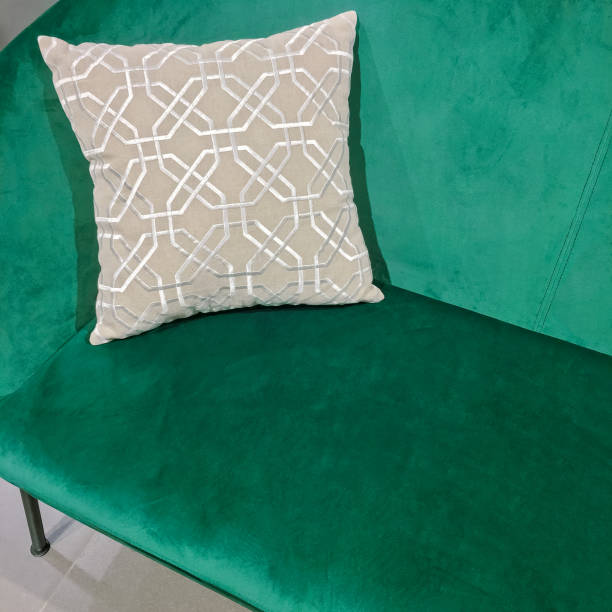 istock Green velvet sofa with ornate cushion 920710508