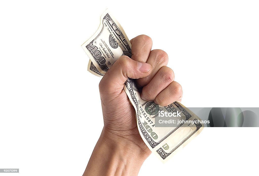 financial concept - hand with money financial concept - hand grabbing dollars isolated on white Paper Currency Stock Photo