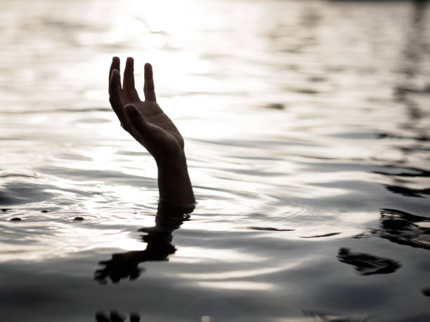 istock Drowning victims, Hand of drowning man needing help. Failure and rescue concept. 920717824