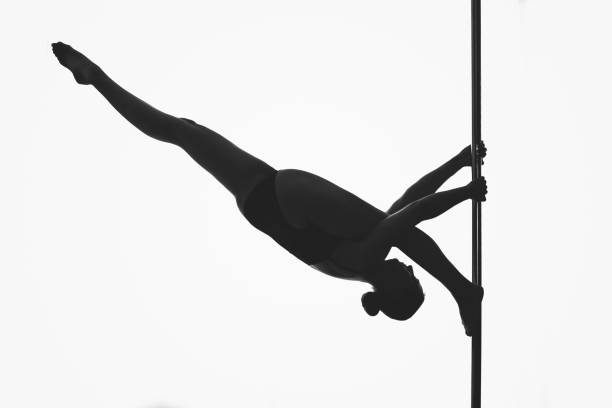 istock beautiful pole dancer girl silhouette 920717926