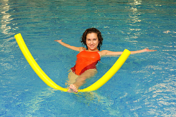 The woman does exercise in water stock photo