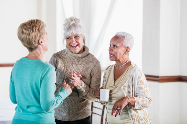istock Three multi-ethnic senior women socializing over coffee 920723574