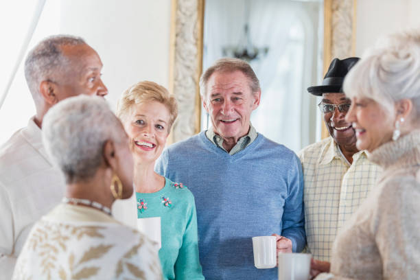 istock Group of seniors socializing over coffee 920727888