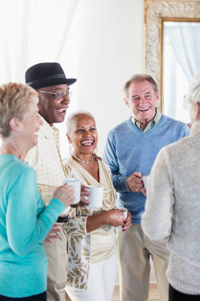 istock Group of seniors socializing over coffee 920727980