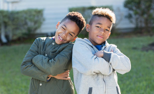istock Confident mixed race boys, brothers standing together 920733462