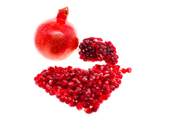 istock Open fresh ripe pomegranates on wooden background 920735860