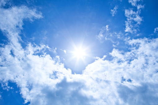Sun background with clear blue sky.