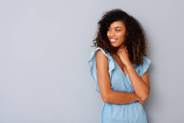 istock young black woman with curly hair looking at copy space 920743214