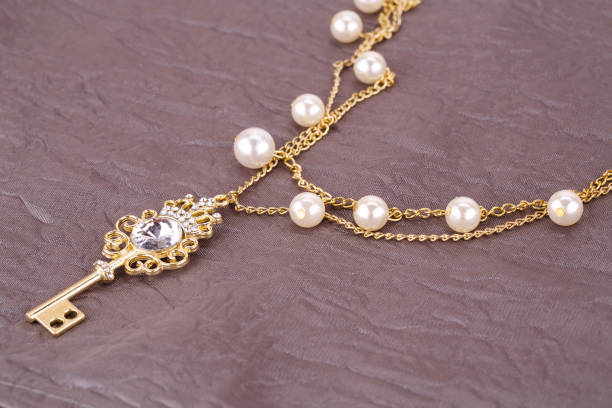 istock Stylish necklace with pearls and key 920743688