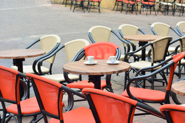 istock Two cups of coffee on a table in an empty cafe on the street 920744182