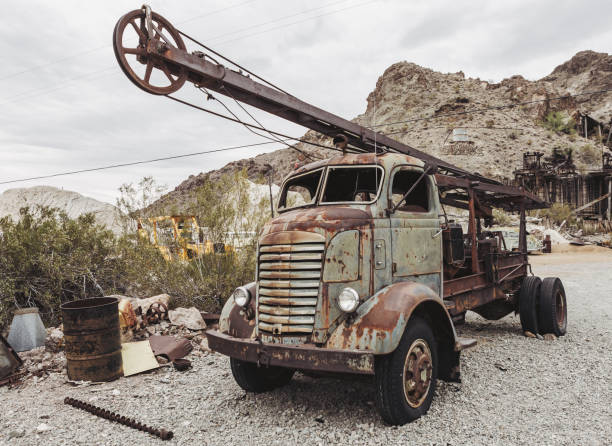 istock Old vintage rusty car truck abandoned in the desert 920749862