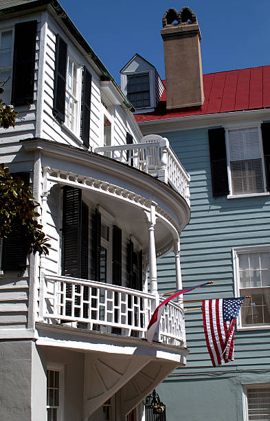istock american flag hanging from old Southern home 92075831