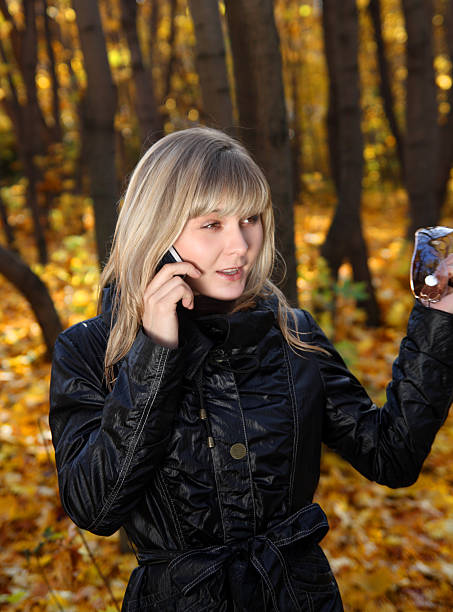 istock young woman talking by phone 92076272