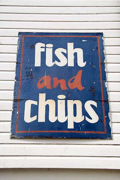 istock Weathered fish and chips sign at seaside 92077141