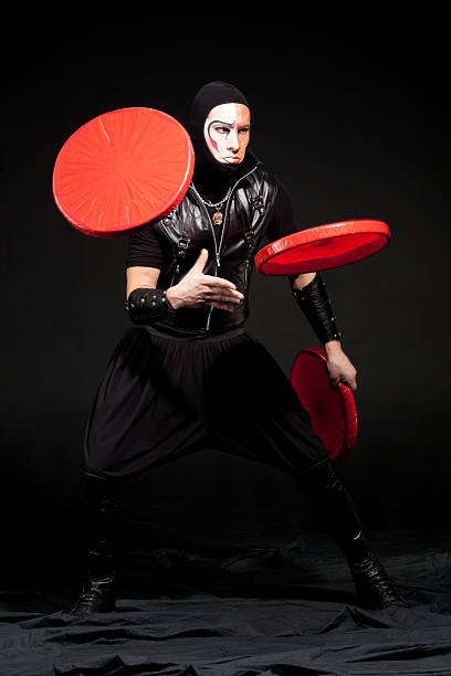 istock Circus juggler in costume on black Background 92077577