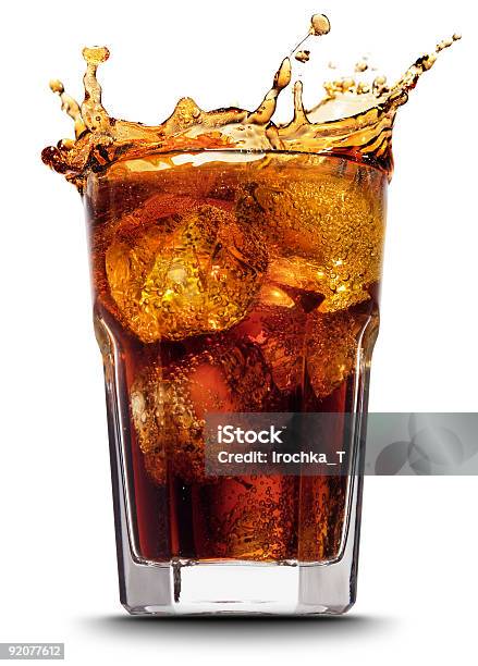 Closeup Of Splashing Cola After Adding Ice Cubes Stock Photo - Download Image Now - Cola, Splashing, Ice