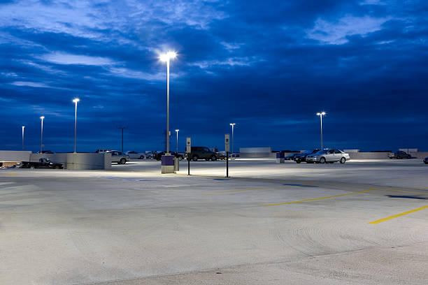 istock Nearly Empty Concrete Parking Lot At Dusk 92078016
