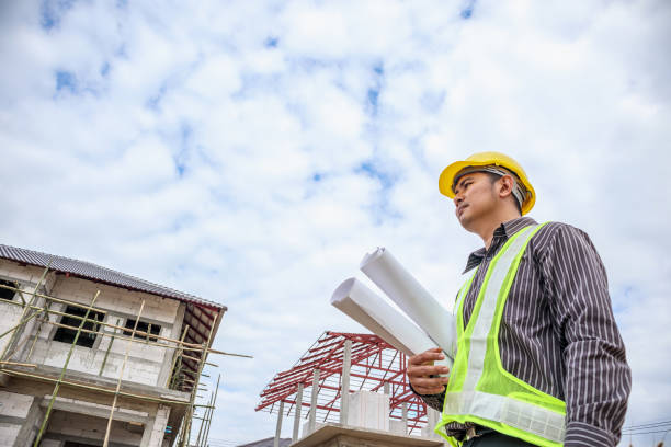 istock Asian business man construction engineer worker at house building site 920782188