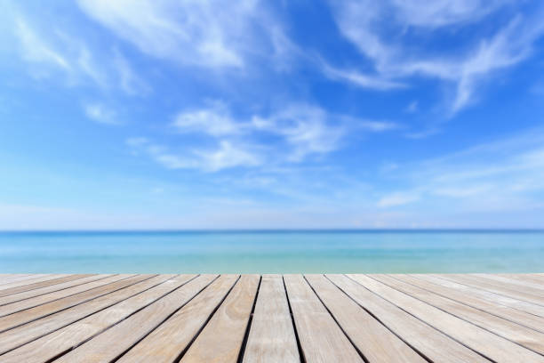 istock Grey wood decking and tropical beach 920782426