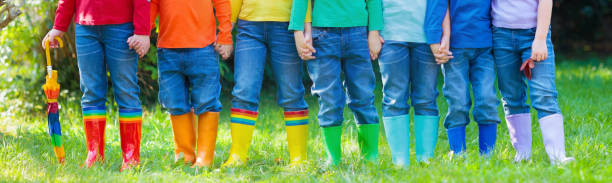 istock Kids in rain boots. Rubber boots for children. 920786840