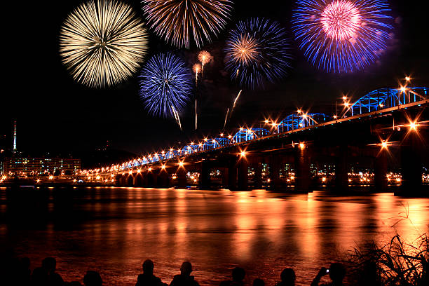 istock A view of fireworks at night over a bridge 92079174