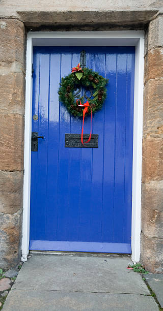 istock Blue Painted Door at Christmas with Holly wreath. 92079360
