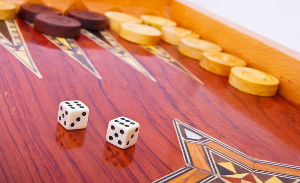 istock White dices on wooden handmade backgammon board isolated 92080248