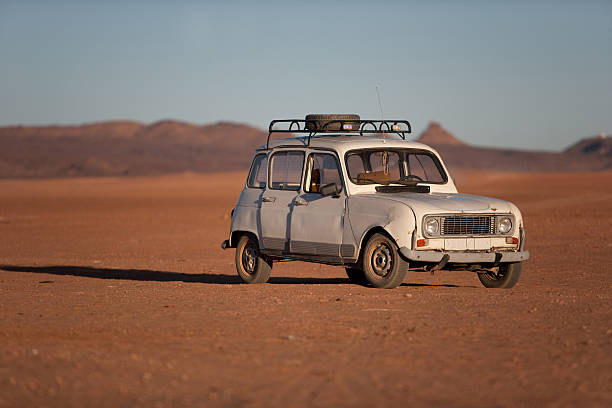 Old car in a desert stock photo