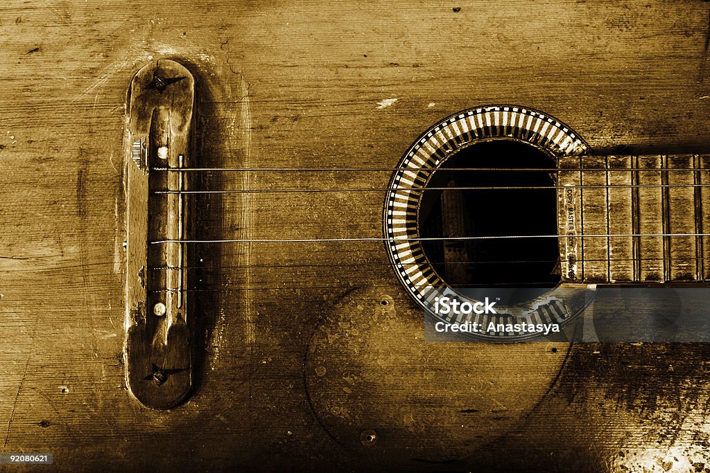 Close up of rugged brown guitar, missing a string  old guitar Ancient Stock Photo