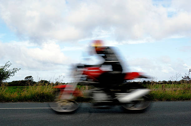 istock Concept speed, speeding blurred motorcycle on country road 92080793