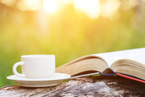 istock Coffee cup and book on wood 920808970