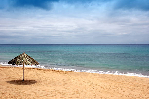 beach of sand with sun hat stock photo